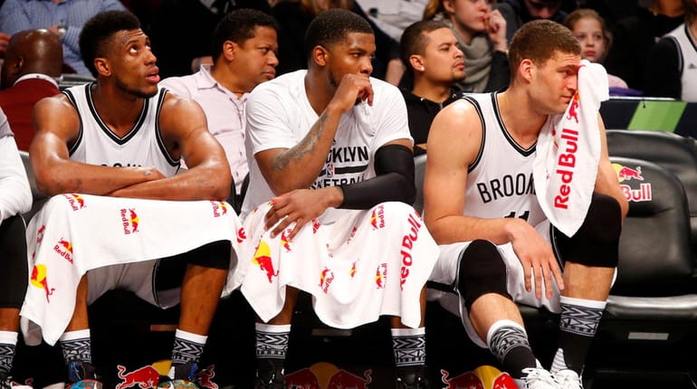 From left, Nets' Thaddeus Young, Joe Johnson and Brook Lopez...