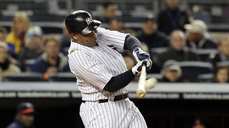 Andruw Jones of the New York Yankees hits a home...