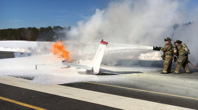 Emergency crews respond to a plane on fire at Brookhaven...