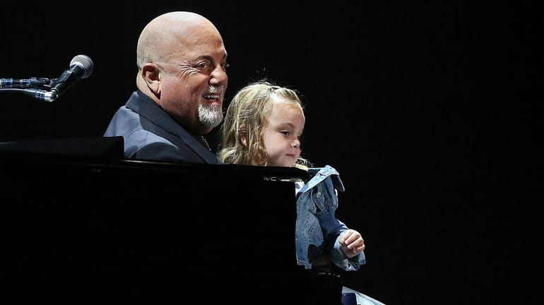 Billy Joel, with his daughter Della, at his 100th show at...
