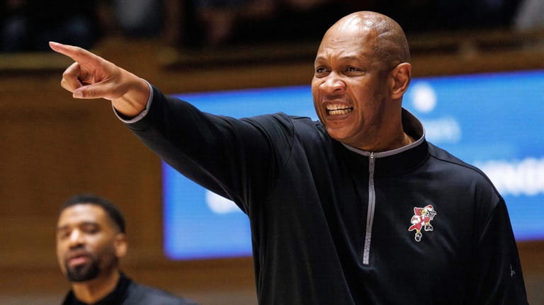 Louisville coach Kenny Payne gestures to players during the first...