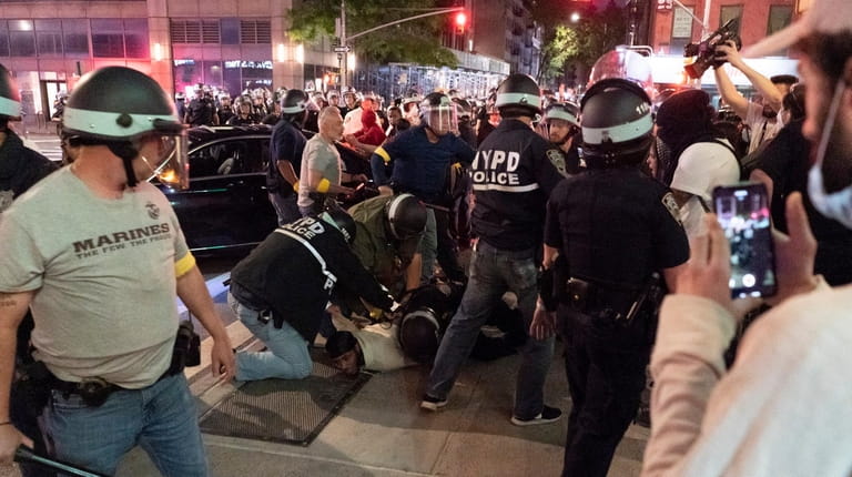 Members of the NYPD detain demonstrators in Manhattan on June...