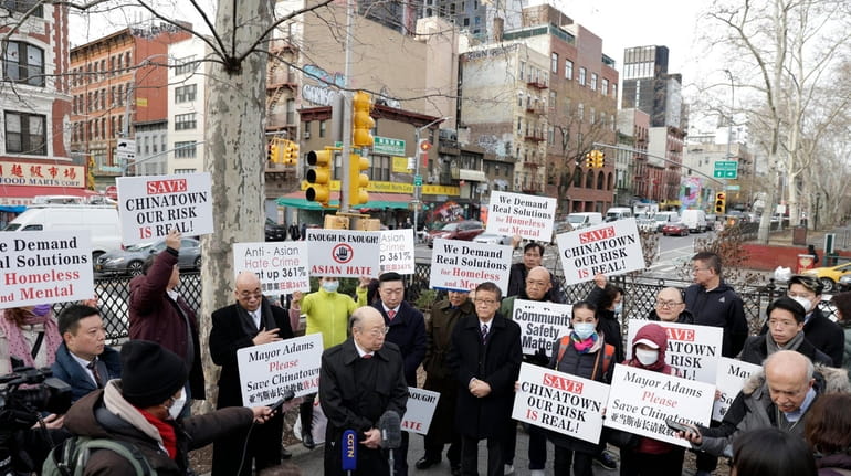 Chinatown civic and community leaders rally Tuesday after the death...
