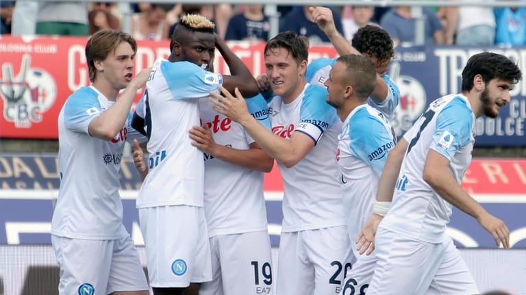 Napoli's Victor Osimhen, 2nd left, celebrates with teammates after scoring...