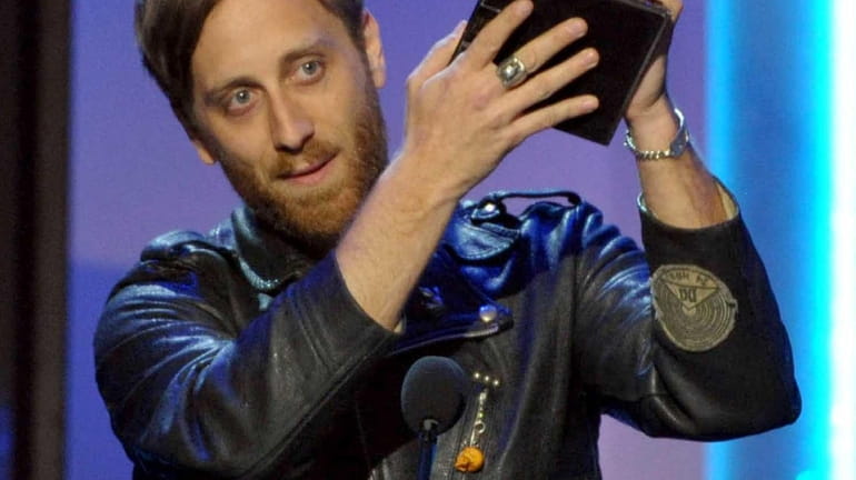 Dan Auerbach accepts the award for producer of the year,...