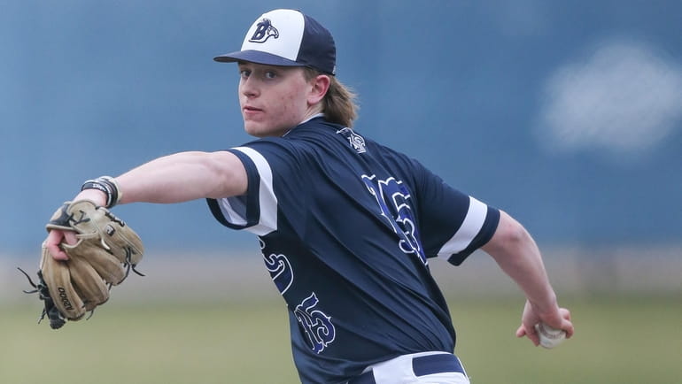 St Dominic’s Vic Frederick pitches in the third inning against...