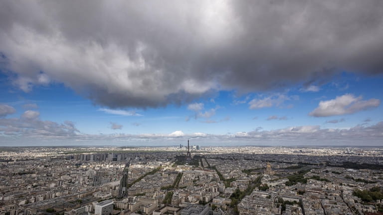 Paris city, with the Eiffel Tower at center, are pictured...