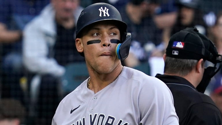 The Yankees' Aaron Judge reacts after striking out swinging during...
