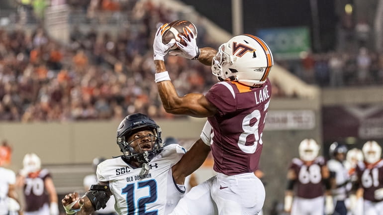 Virginia Tech's Kyle Lane, right, makes a catch against Old...