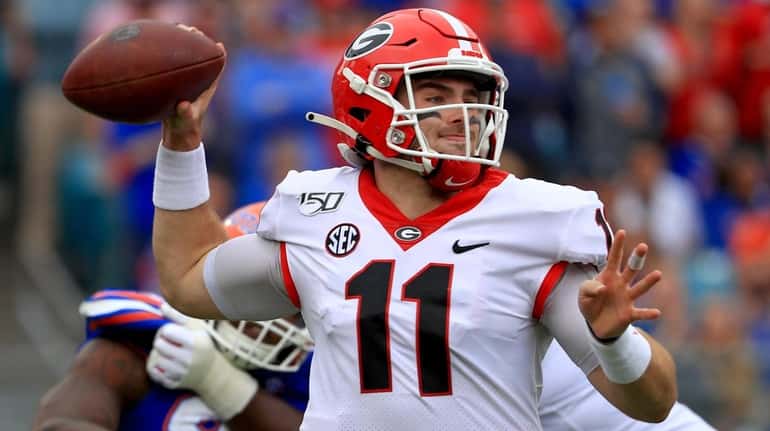 Jake Fromm of the Georgia Bulldogs passes during a game on Nov....