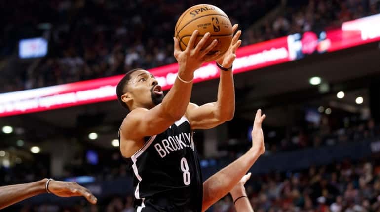 Nets guard Spencer Dinwiddie drives to the hoop against Toronto...