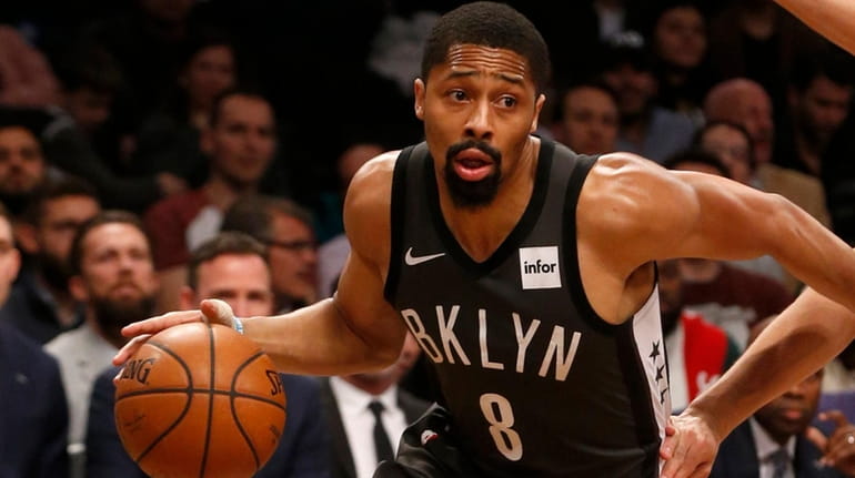 Spencer Dinwiddie of the Nets drives to the hoop in...