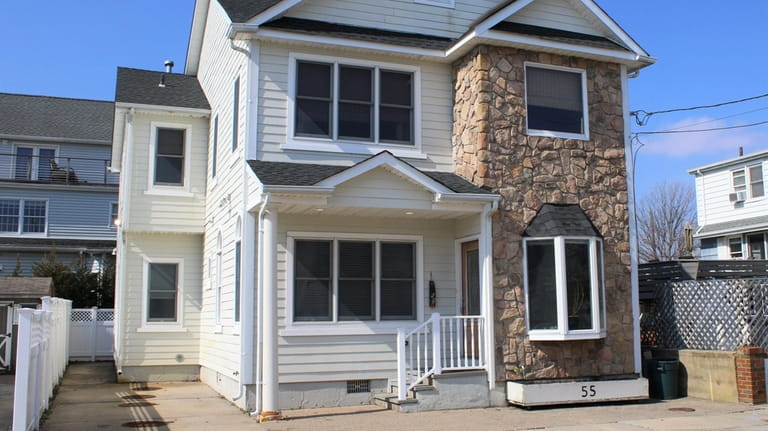 Priced at $989,000, this Cedarhurst Avenue estate home has a...