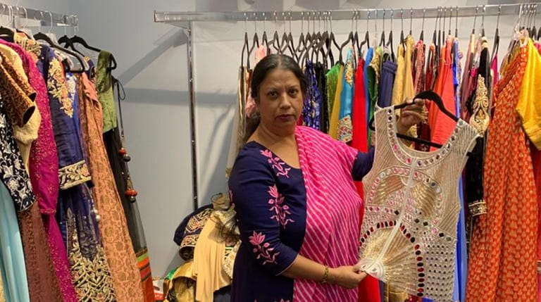 Poonam Jain stands inside her shop, Vastra Boutique in Hicksville,...