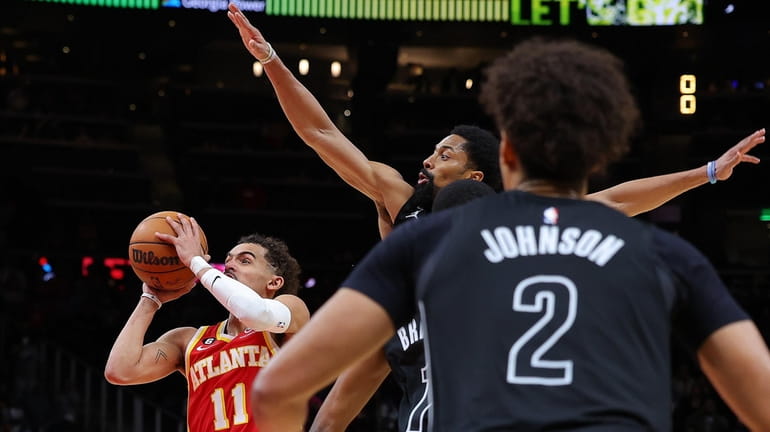 Trae Young #11 of the Atlanta Hawks shoots the game-winning...