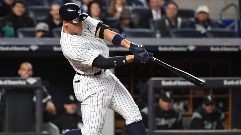 Yankees' Aaron Judge hits a solo home run against the...