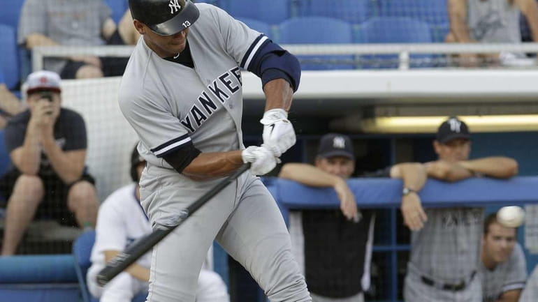 New York Yankees' Alex Rodriguez hits a first-inning home run...