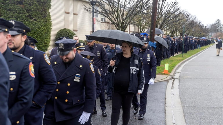 Officers line up to attend the wake for NYPD Officer...