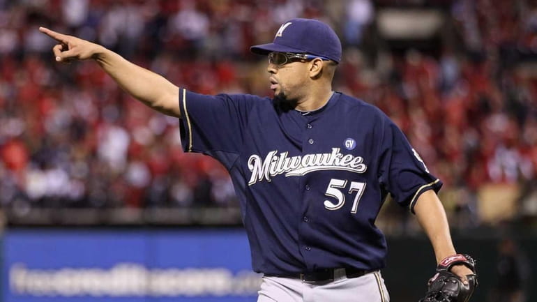 Francisco Rodriguez #57 of the Milwaukee Brewers reacts after he...