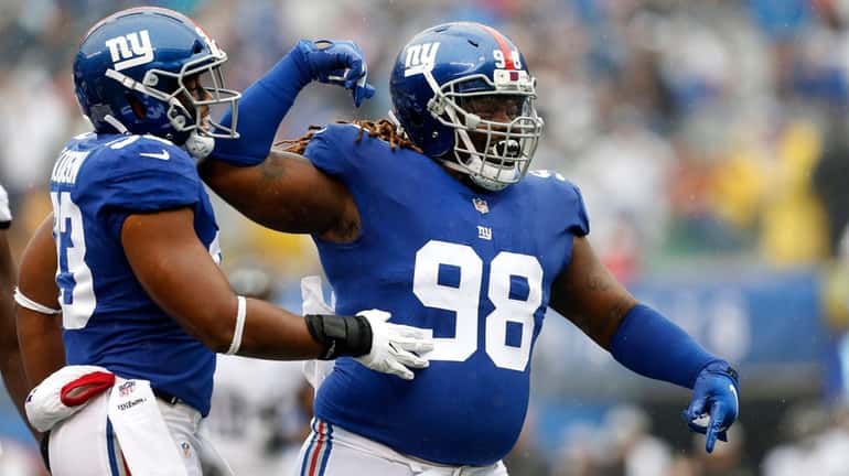 Damon Harrison of the Giants reacts after a play against...
