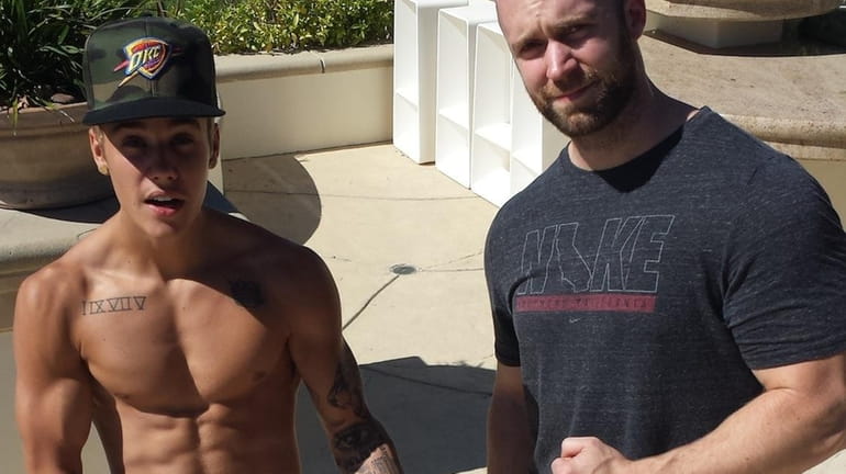 Justin Bieber and his trainer, Patrick Nilsson, right, created a...
