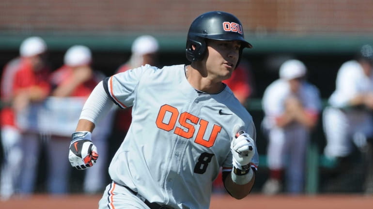 Oregon State's Michael Conforto rounds first base on a hit...