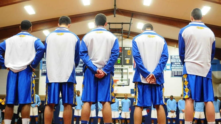 Kellenberg High School varsity boys basketball players honor late athletic...
