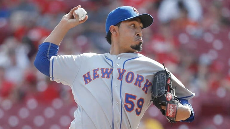 New York Mets relief pitcher Fernando Salas throws in the...