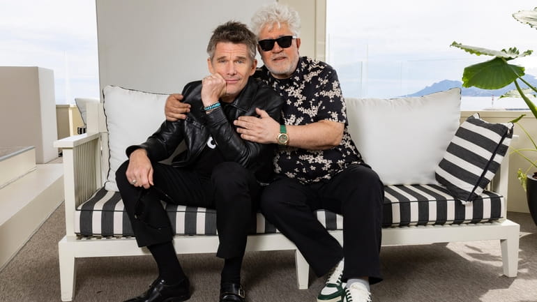 Ethan Hawke, left, and director Pedro Almodovar pose for portrait...