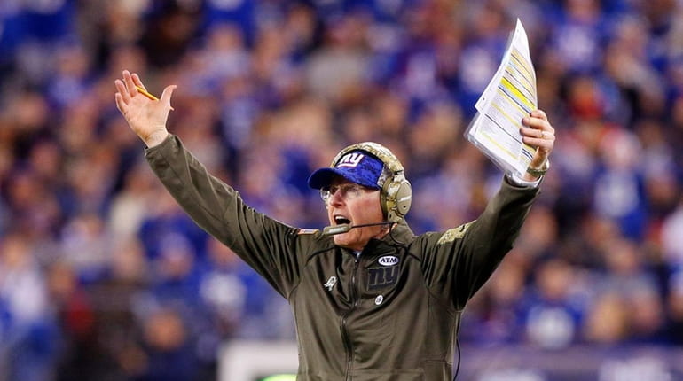 Giants coach Tom Coughlin reacts after a play in the...