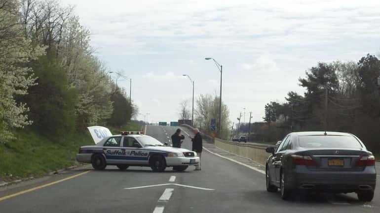 Police close off part of Expressway Drive South near Exit...