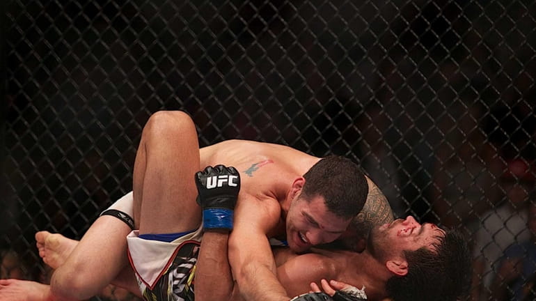 UFC middleweight champion Chris Weidman, from Baldwin, successfully defended his...