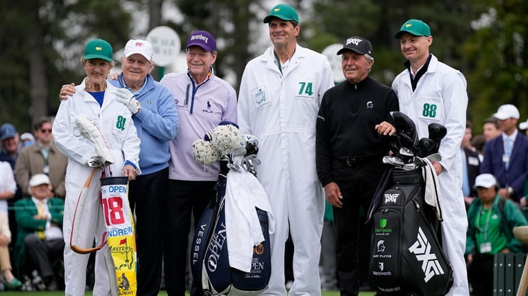 Jack Nicklaus, second from left, poses with his wife Barbara,...