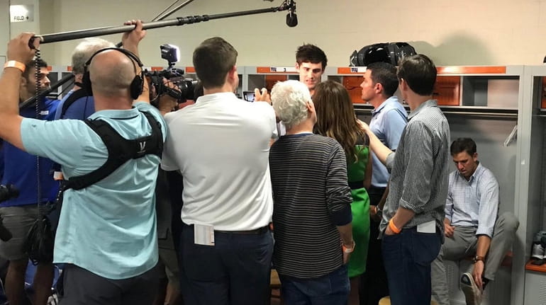 Giants rookie quarterback Daniel Jones is surrounded by media as...