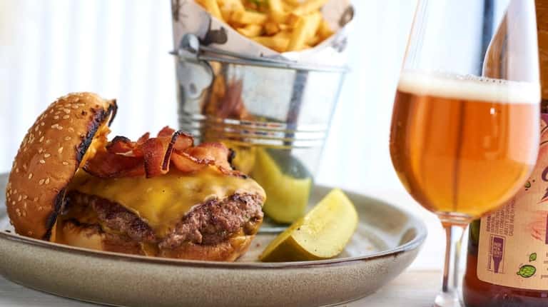 The double-smashed burger with Shelburne Cheddar cheese and bourbon bacon...