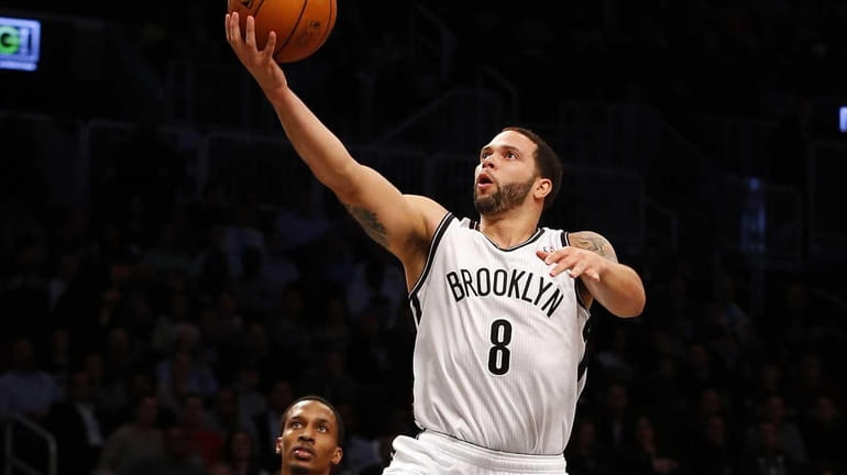 Deron Williams of the Brooklyn Nets goes to the hoop...