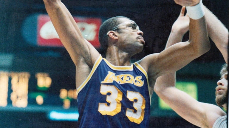 The Lakers' Kareem Abdul-Jabbar takes a hook shot against the...