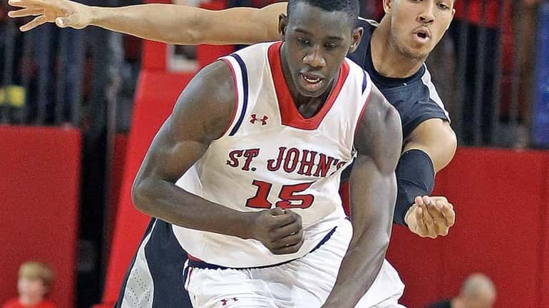 St. John's Sir'Dominic Pointer charges up the court against Providence's...