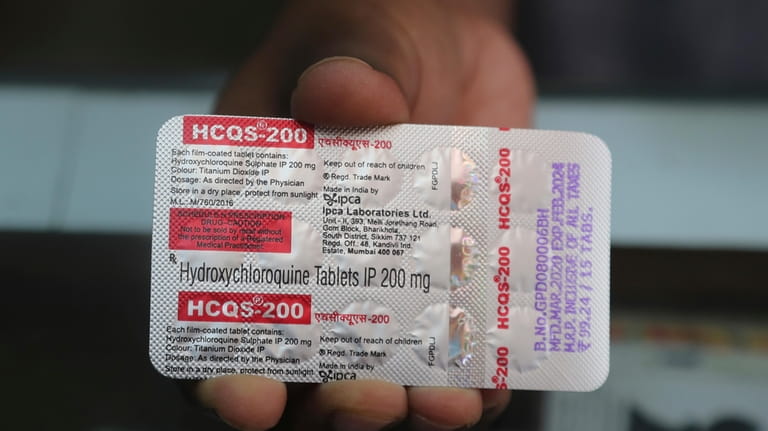 A chemist displays hydroxychloroquine tablets in Mumbai, India, Tuesday, May...