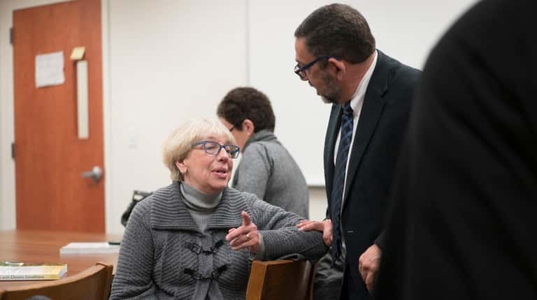 RSVP executive director Pegi Orsino, left, speaks with Guardianship Corp chief...