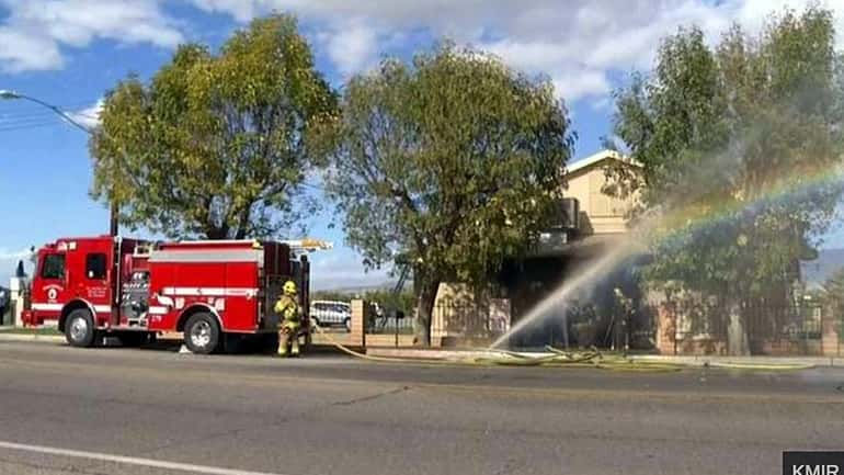In this image made from video provided by KMIR-TV, firefighters...