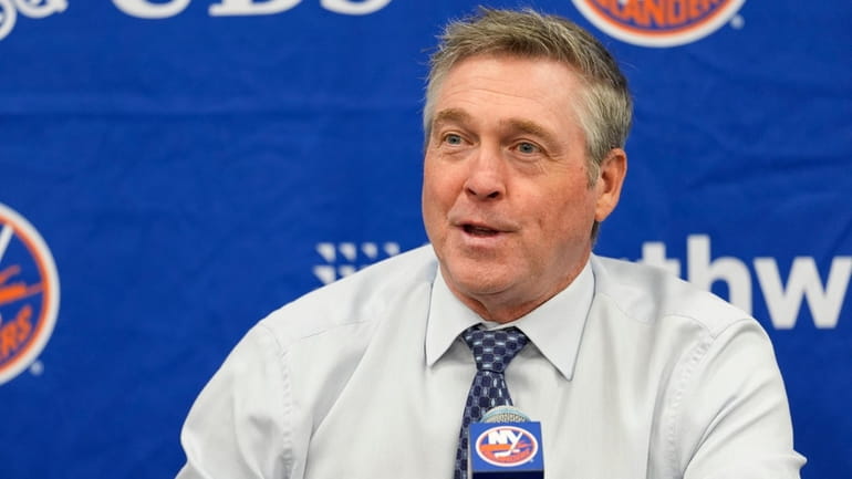 Patrick Roy speaks to reporters after his first game as Islanders...