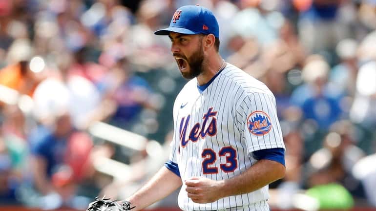 David Peterson of the Mets reacts after a fourth-inning-ending double...