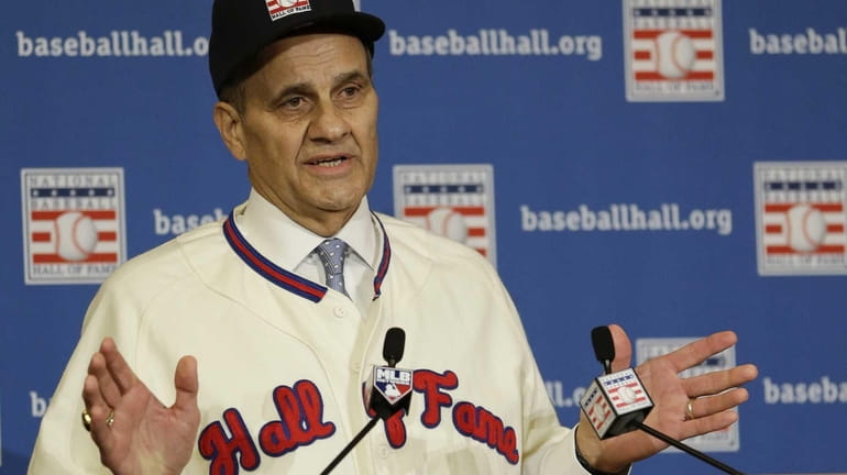 Joe Torre speaks at a news conference after it was...