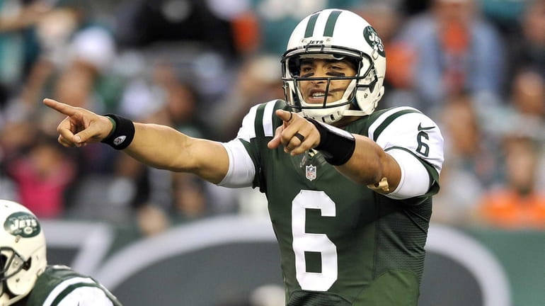 Mark Sanchez calls an audible during the second half of...