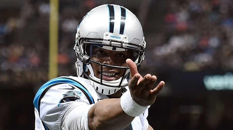 Cam Newton #1 of the Carolina Panthers celebrates a touchdown...