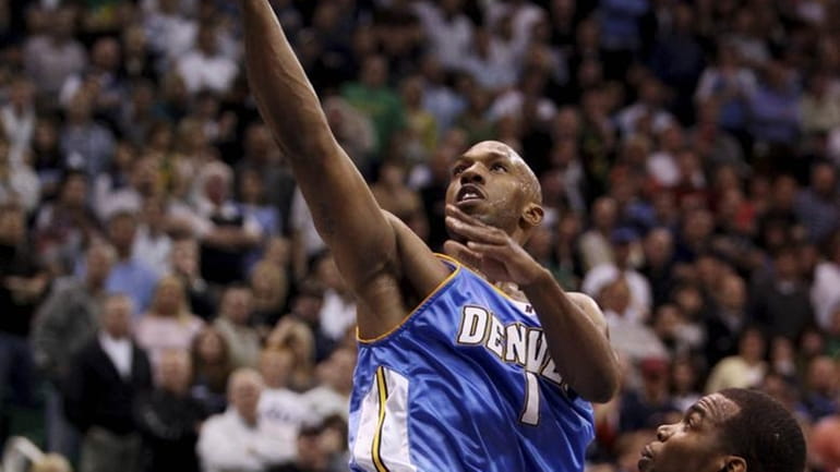 Denver Nuggets guard Chauncey Billups (1) goes to the hoop...