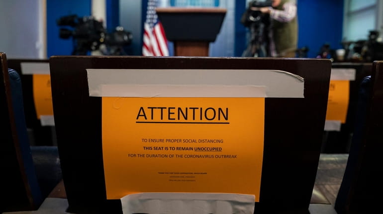 Signs in the briefing room of the White House indicate...