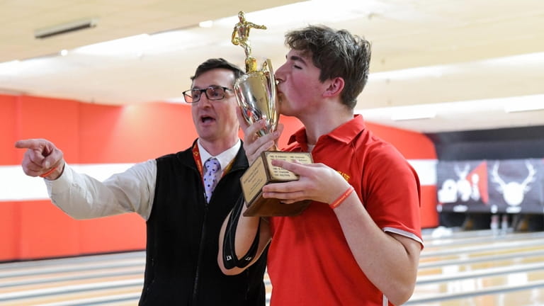 Aidan Kennedy of Chaminade and coach Terence Fitzgibbon celebrate Chaminade’s win...