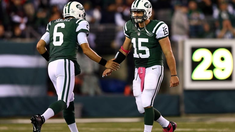 Mark Sanchez re-enters the game to replace Tim Tebow in...